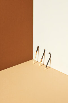Different stages of match burning with shadows.