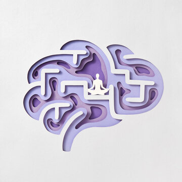Papercraft composition of human brain with paper meditating man.
