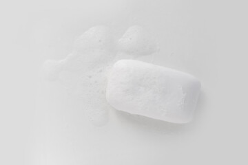 Soap with foam on a white background Soap used in everyday life, including washing, bathing
