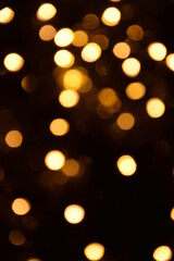 Warm lights blurred bokeh abstract on dark background, rozmyte światełka na ciemnym tle lampki świąteczne