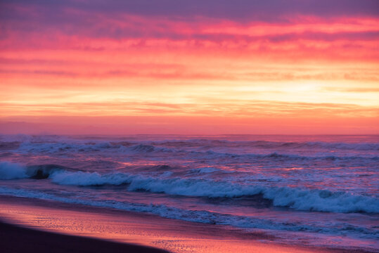Marine landscape on the background colorful cloudy sky on Khalaktyrsky Beach, Kamchatka.