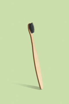 Natural wooden toothbrush vertical balancing.