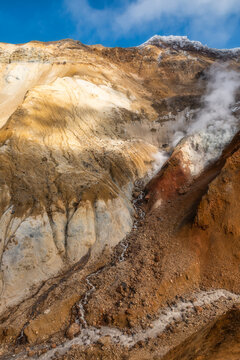 Rock cleft with volcanic steam, volcano Mutnovsky.