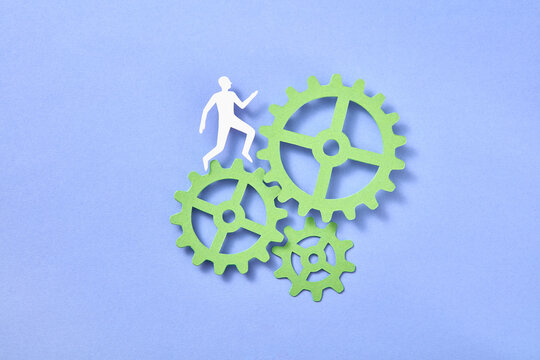 Papercraft man is running up the clockwork.