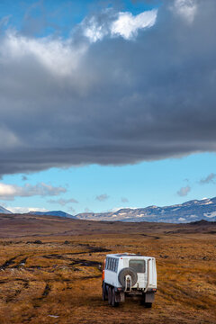 Big off-road vehicle explores the valley of the Giants in Kamchatka, Russia.