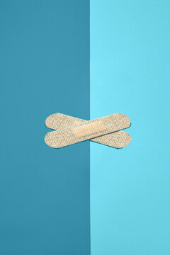 Crossed strips of adhesive antibacterial plaster.