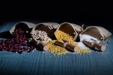 Studio lighting. red paprika spice on a wooden spoon, on a white background. There is a shadow. Close-up. No isolation.