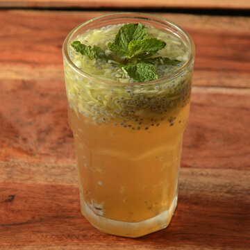 Shikanji or Lemon Sharbat is most favourite cool drinks of India, served in a glass over a rustic wooden background,a refreshing drink for summer days, selective focus on top