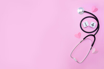 Stethoscope medical equipment with pink hearts on pastel background. health care with love. valentine's day