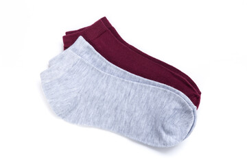 two pairs of colored short socks on a white background, top view