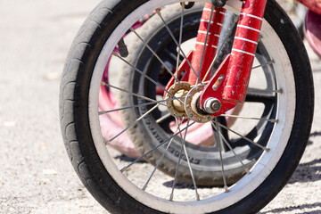 Close up of the fron wheel of a childs bicycle
