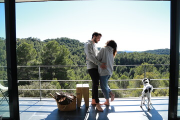 happy couple with pet on terrace