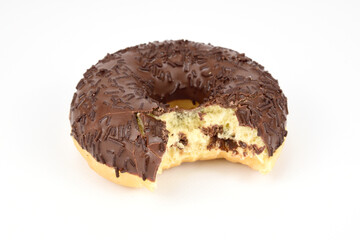 Chocolate donut sprinkled with a bite off.