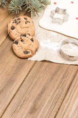 Dough for baking cookies on paper. Cookie cutter molds, ready-made cookies