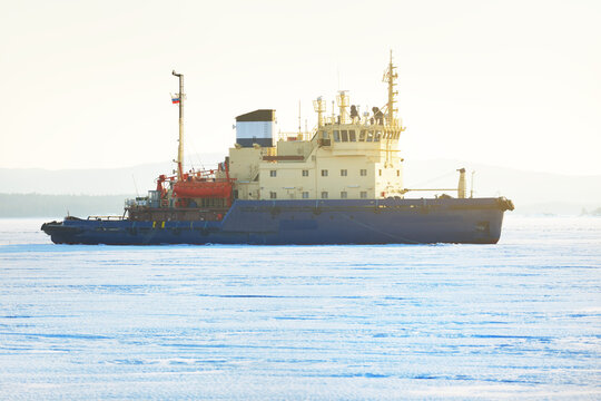Icebreaker close-up. White Sea, Polar Circle, Russia. Ice texture. Concept winter landscape. Ecology, environment, climate change, expedition, work, research, Arctic shipping routes, logistics