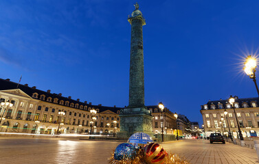 Fototapeta na wymiar The famous Vendome column at night with Christmas baubles , Paris, France.