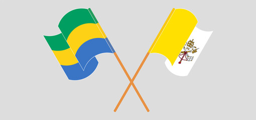 Crossed and waving flags of Gabon and Vatican