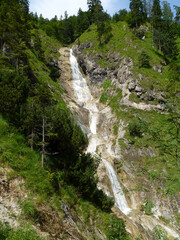 Fototapeta na wymiar Waterfall at Hausbachfall via ferrata in Reit im Winkl, Bavaria, Germany