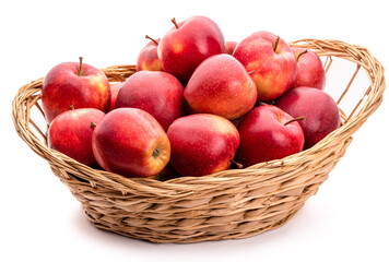 Red apples in a wicker basket. Isolate on white background