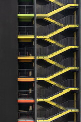 bright yellow external fire escape of new multilevel parking building