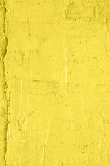 Concrete yellow colorful wall surface texture. Abstract grunge bright illuminating color background with aging effect. Copyspace.
