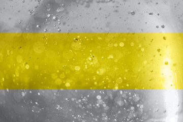 Photo of the texture sparkles bokeh in grey and yellow illuminating colors. Color year 2021.