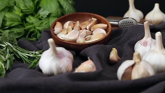 Fresh garlic and herbs on table