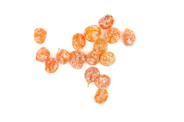 Candied kumquats, heap of dried fruits isolated on white background