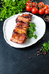 ribs grilled BBQ spices tomato sauce piece of meat second course snack ready to eat on the table meal snack top view copy space for text food background rustic