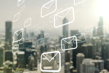 Double exposure of abstract virtual postal envelopes hologram on blurry cityscape background. Electronic mail and spam concept