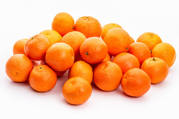 Ripe orange tangerines on the table. Isolate on white background