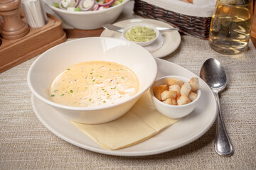 White vegetable soup with tiger-prawns