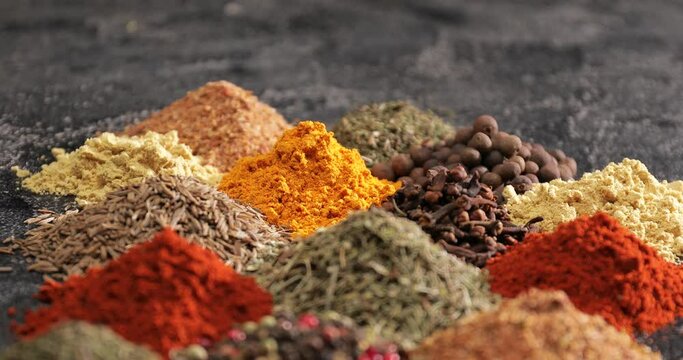Different spices on dark background