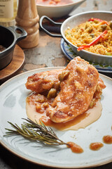 Grilled chicken breast, fillet and fresh vegetable salad and paella rice, olive oil. Healthy lunch menu.