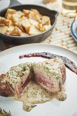 Sliced tenderloin Steak Roast beef on wooden cutting board on white background
