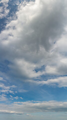 Fantastic clouds against blue sky, panorama