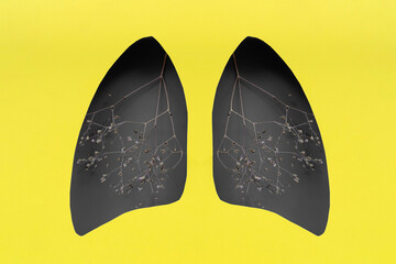 Lungs symbol paper art with dry branches, gray and yellow. World tuberculosis day. Health care, medicine, lung cancer, internal donor organ and stop smoking campaign.