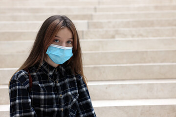  young teenager girl with a mask