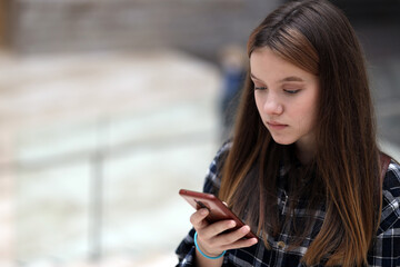 young girl using mobile phone