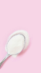 Collagen white powder. Pastel color background. Health product. Woman cosmetics concept. Sport...