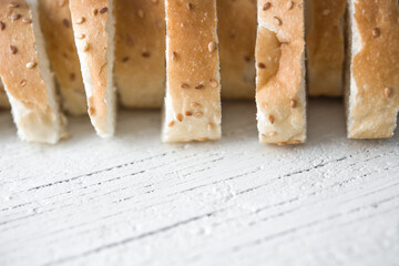 Fresh bread sliced baguette in white background