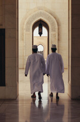 a few men wearing robes and hats