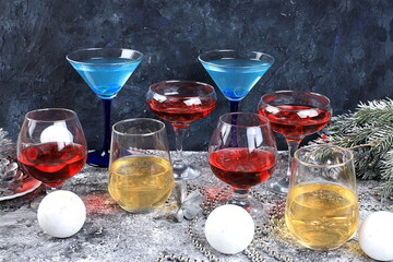 Assortment of alcoholic cocktail with lemonade, wine, champagne, grog or martini in glasses on a...