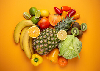 Fototapeta na wymiar Fruit, citrus, vegetables with vitamin C, yellow orange background top view. Vitamin C natural sources for immunity stimulation, against viruses and avitaminosis. Healthy food to boost immune system.