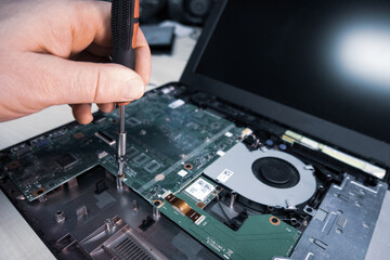 Fototapeta premium opened notebook is repaired in a computer workshop