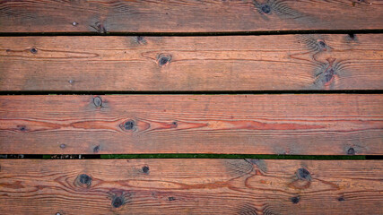 Obraz premium Beautiful background from wet brown boards
