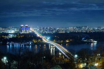Metro bridge across the Dnieper river in Kyiv at night