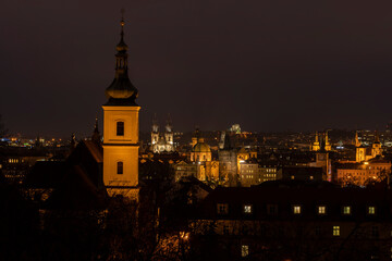 .light from street lights and a view of the city of Prague