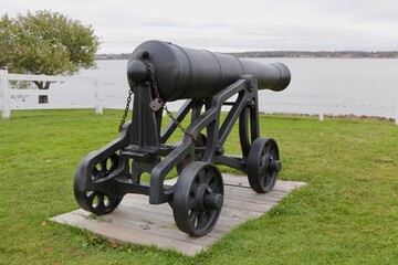 A cannon stands guard over Charlottetown Harbour from Prince Edward Battery in PEI.