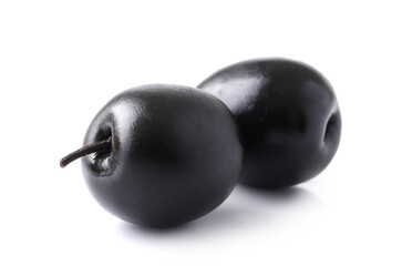 Black olives with pits on white background